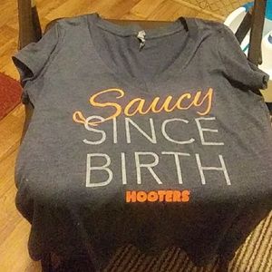 A Hooters tee shirt